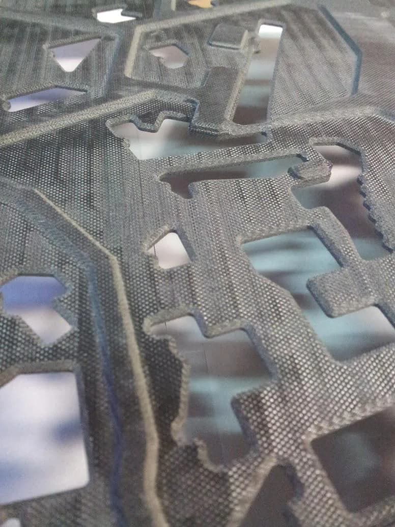Piezas de Durostone maquinadas apiladas — textura de fibra de vidrio